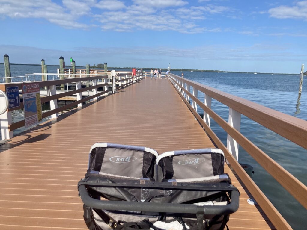 stroller on the pier at dunedin marina in florida