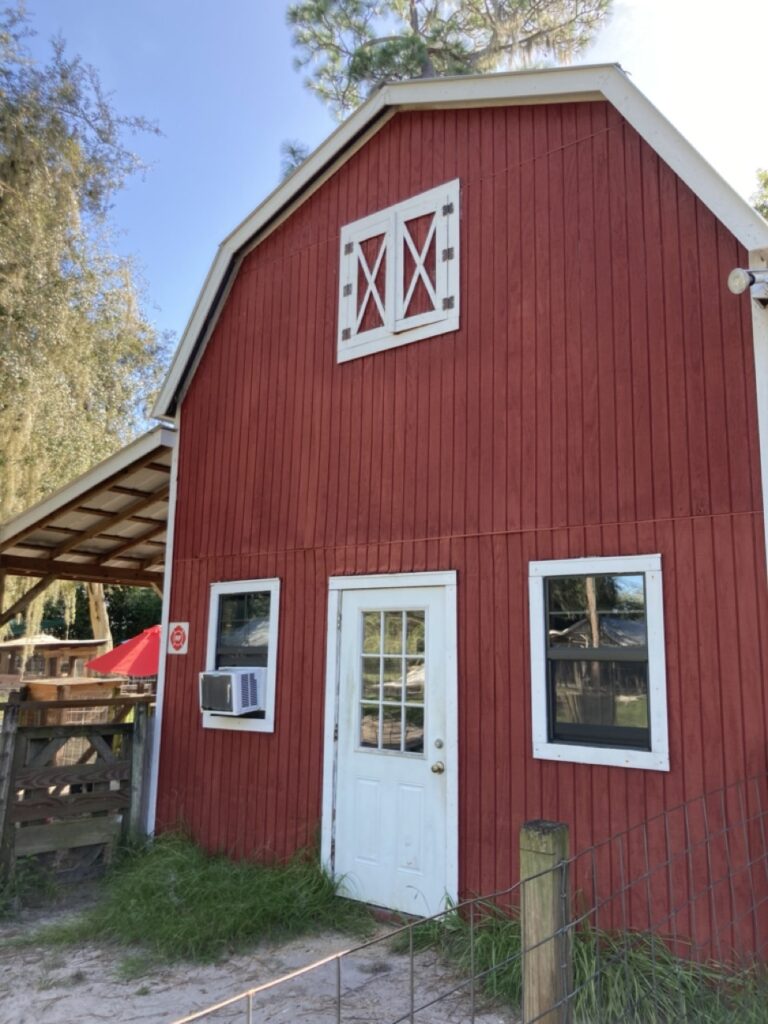 red barn with white door at old mcmickys farm