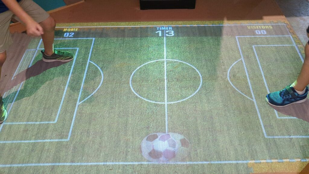 a soccer game that it projected on the floor for kids to play