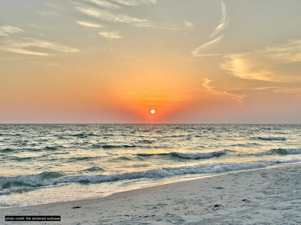 sunset over the beach and gulf of mexico at cape san blas