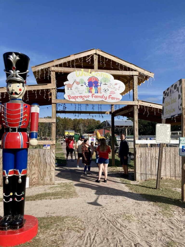 the entrance to raprager family farm with a large nutcracker decoration