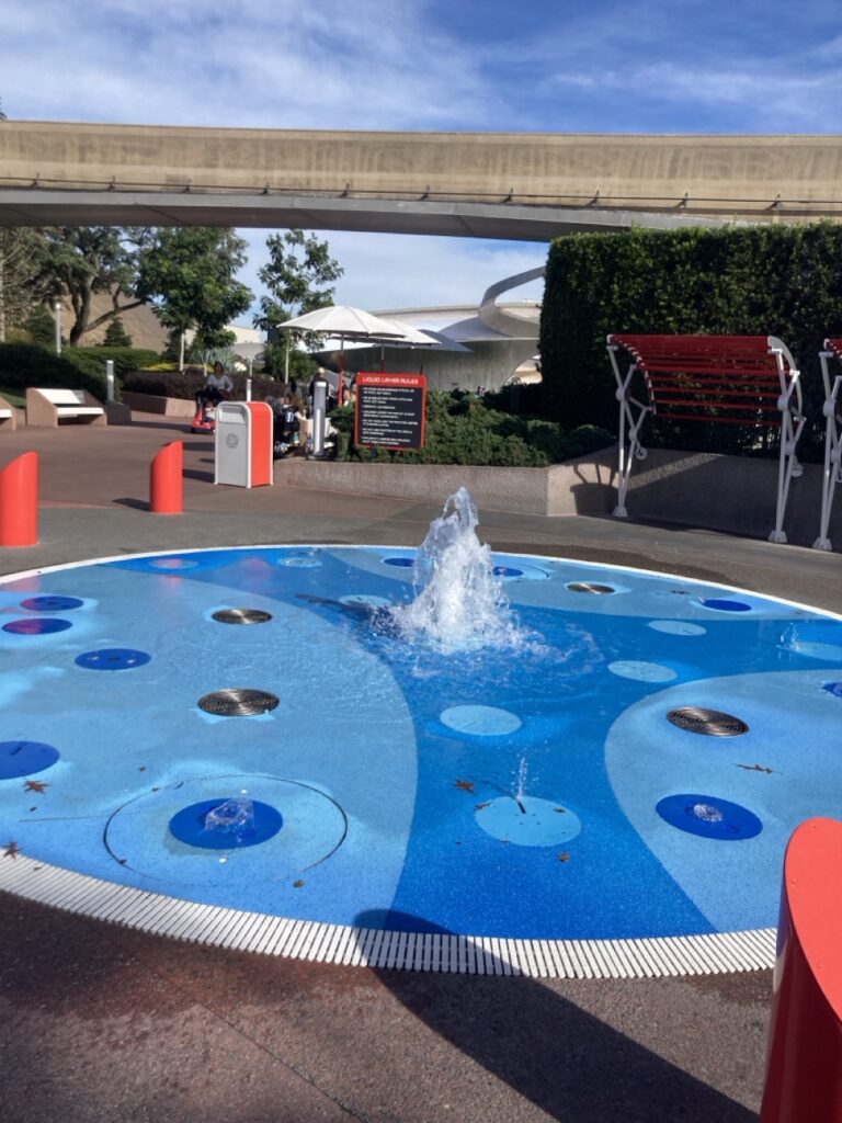 small splash pad with a little fountain in the middle at epcot
