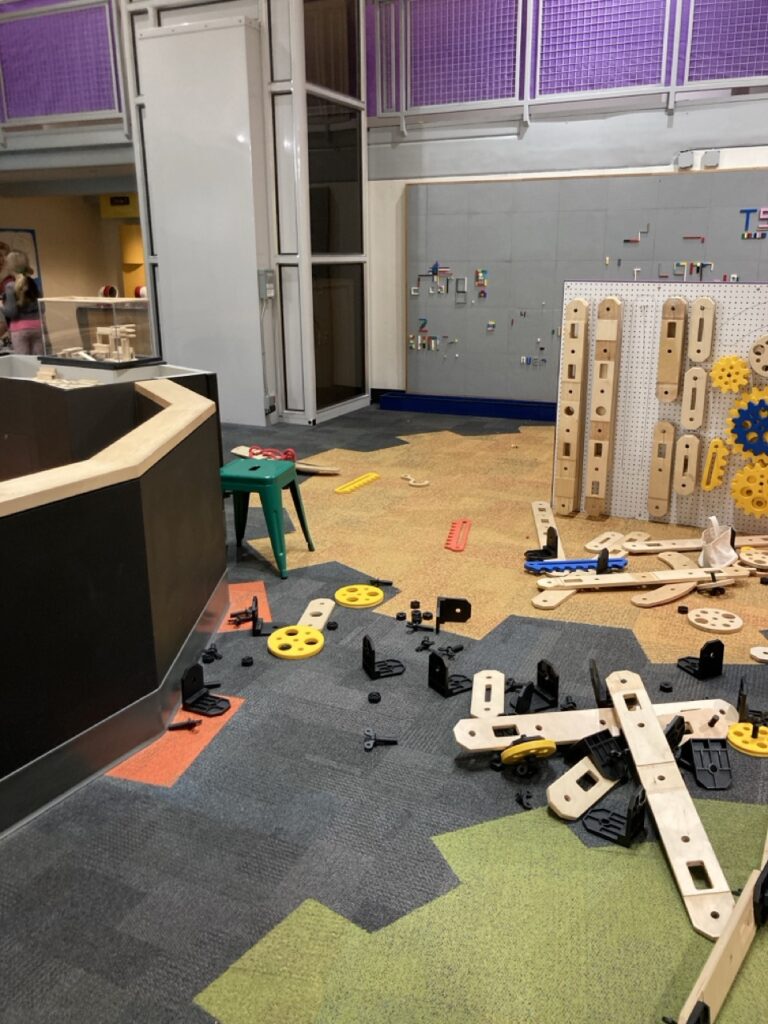 Engineering area with gear pieces on the floor at the Glazer's Children Museum