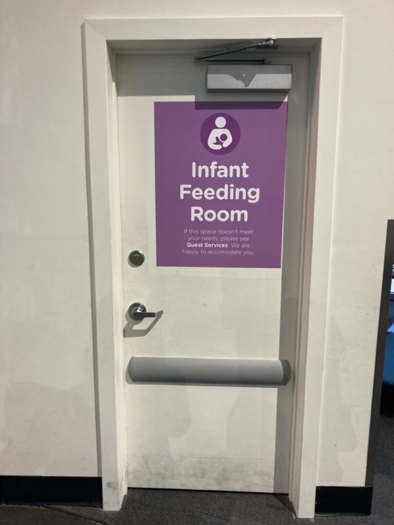 Sign in purple on a door that says Infant Feeding Room