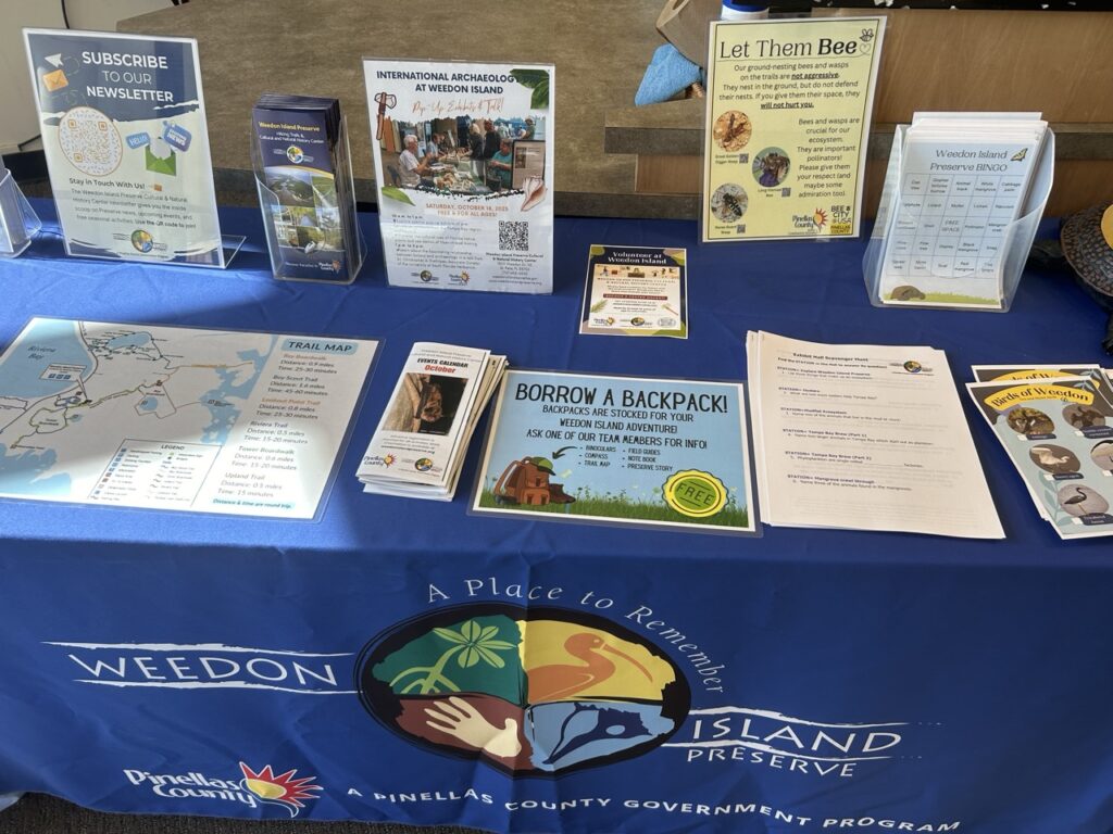 a table with nature flyers and scavenger hunts at the weedon island preserve nature center