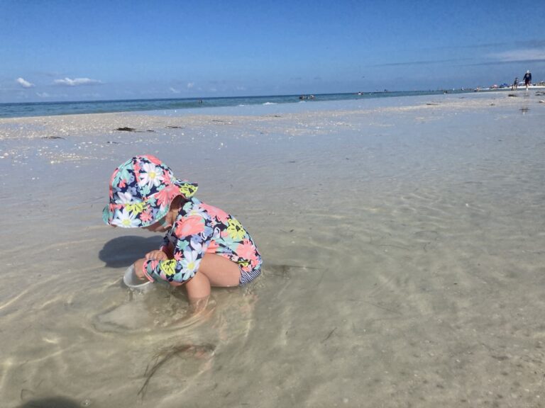toddler in hat in honeymoon island tide pool